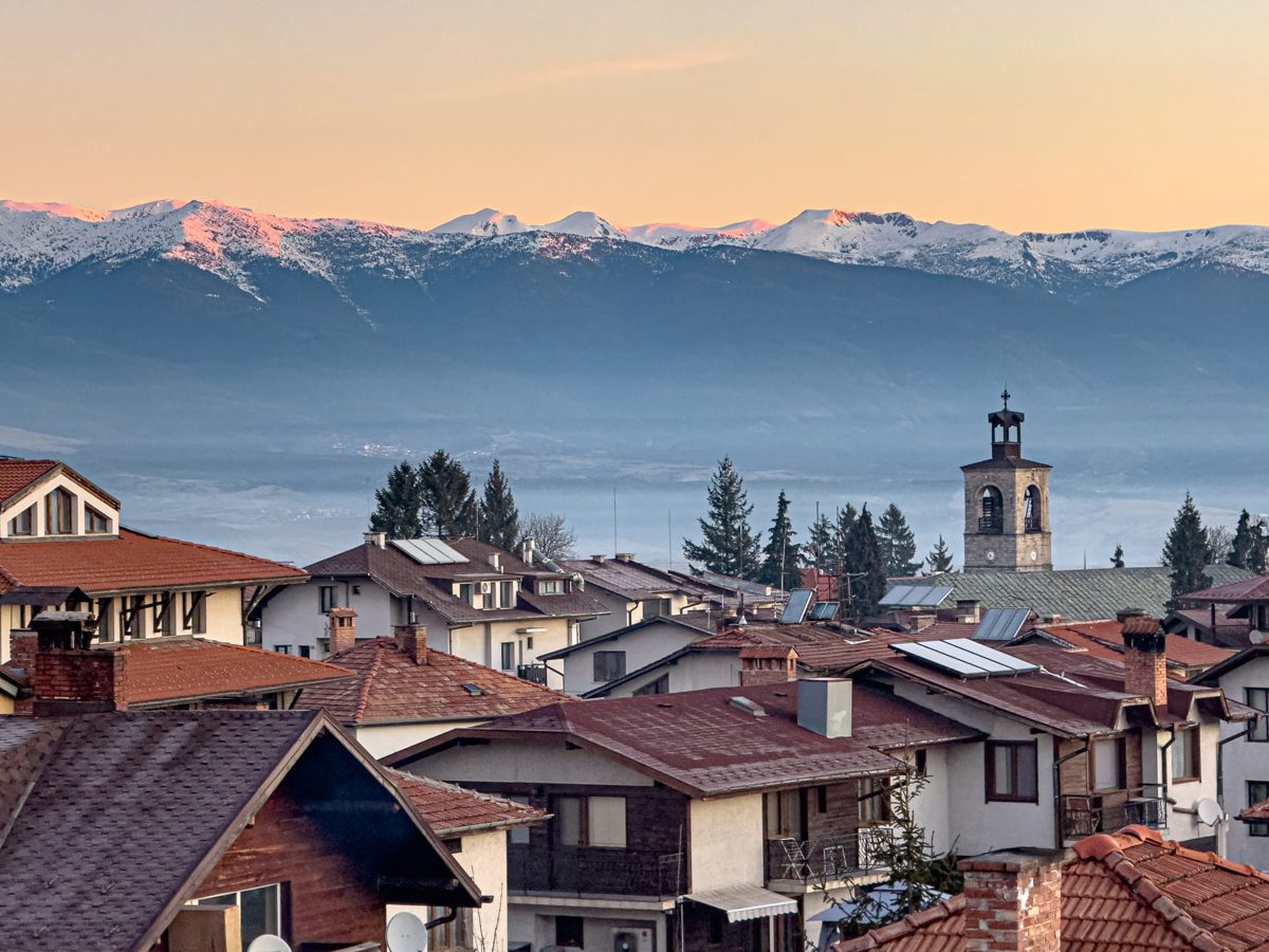 Mountain town rooftops at sunrise