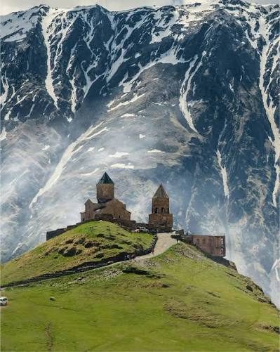 Church below snowy mountains, Georgia